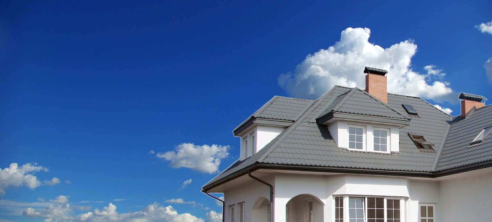 Roof of a house with a blue sky