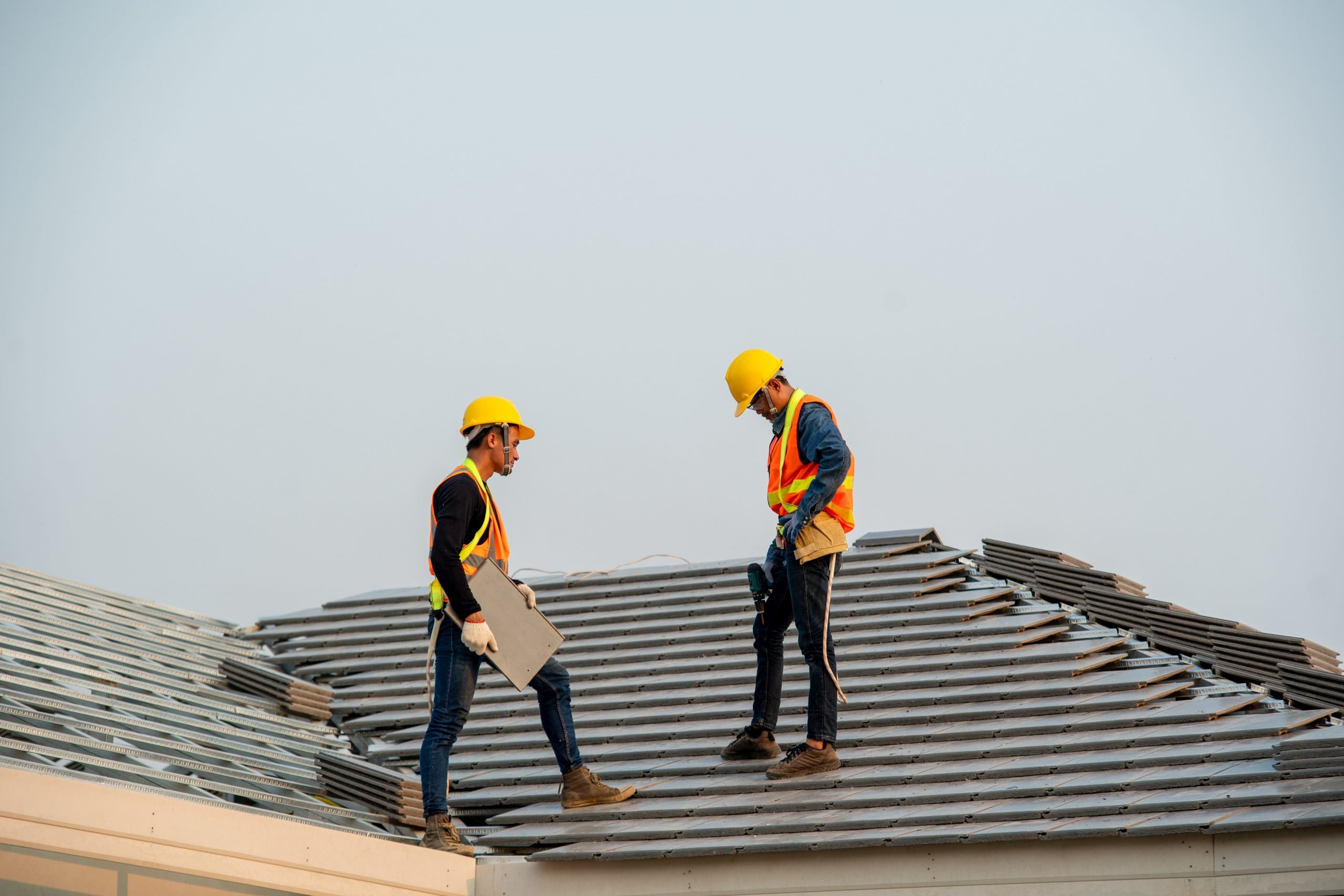 Construction worker wearing safety harness belt during working o