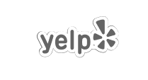 The black and white Yelp logo features the word "yelp" in lowercase letters, followed by a stylized burst or star shape on the right.